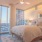 Spacious bedroom with floor to ceiling windows