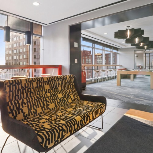 couch by a window with pub seating