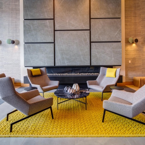 lobby with four chairs and area rug